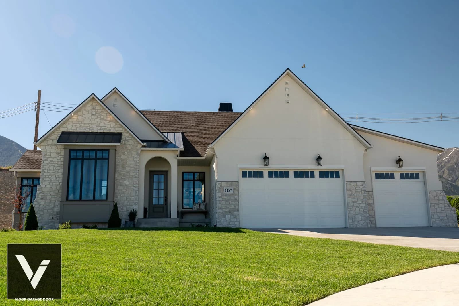 DESIGNER STEEL SERIES Color: Alabaster Design: Long V-Groove Window Design: Stockbridge 4-Lite