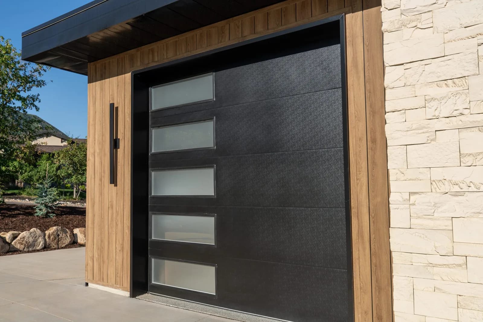 DESIGNER STEEL HIGH PERFORMANCE SERIES Color: Black Design: Flush Panel Window Design: Vertical Stack